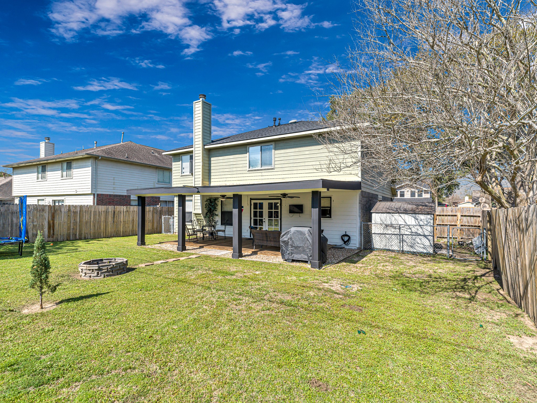 6822 Eagle Ridge Drive Katy, TX 77449 - Photo 35 of 36 a view of a house with a yard and sitting area