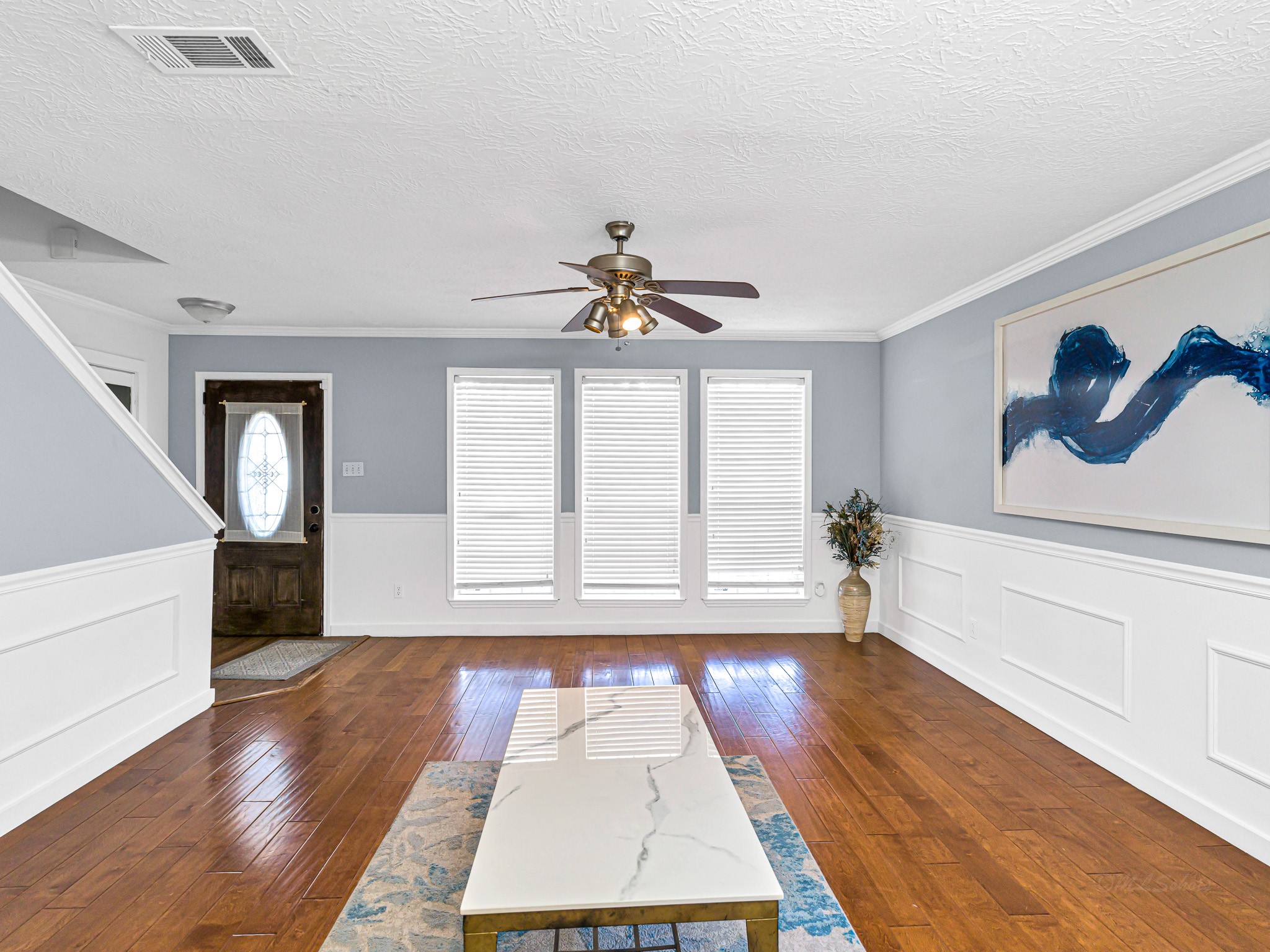 6822 Eagle Ridge Drive Katy, TX 77449 - Photo 7 of 36 a view of empty room with wooden floor and fan