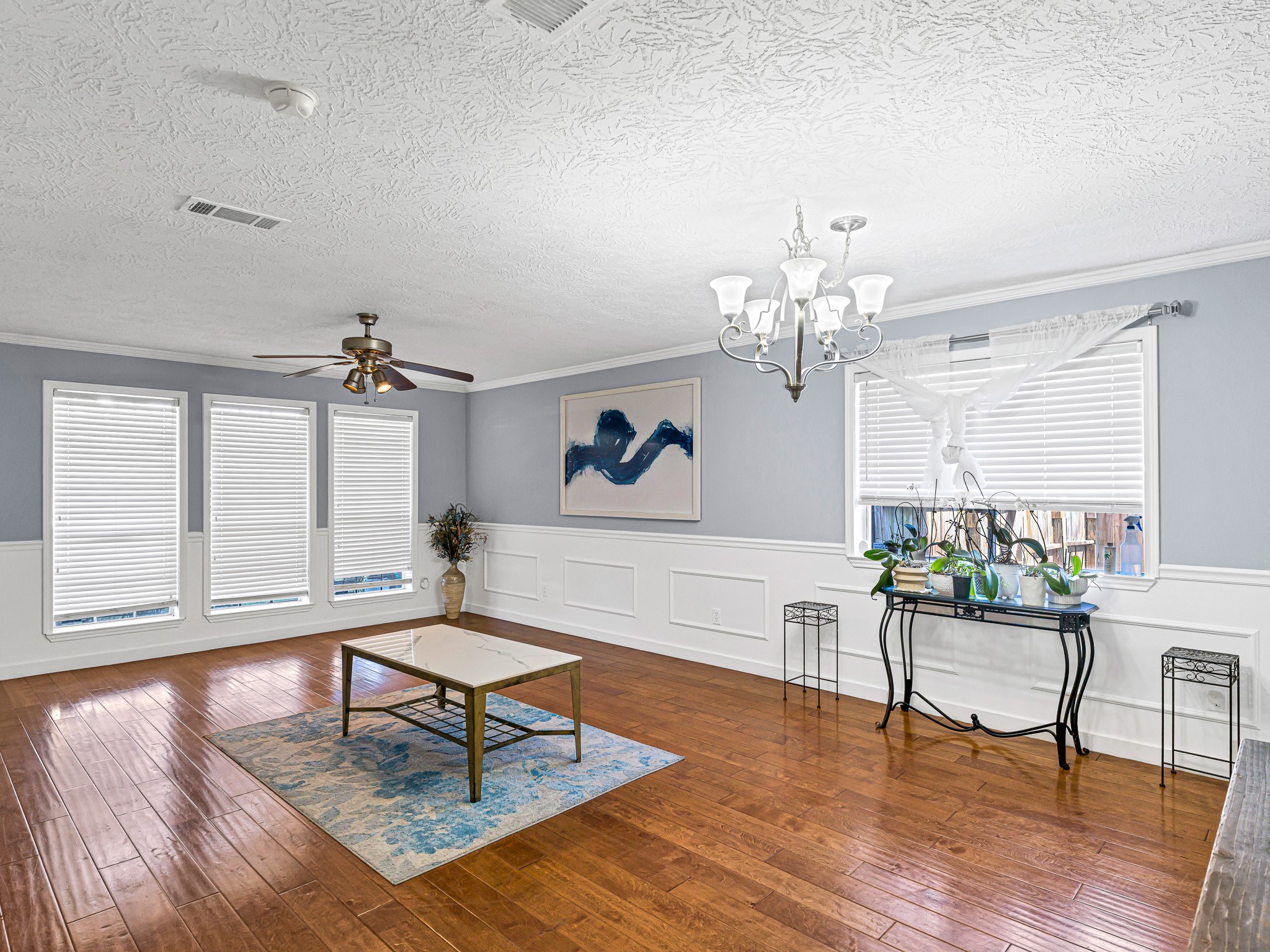 6822 Eagle Ridge Drive Katy, TX 77449 - Photo 10 of 36 a living room with furniture and a chandelier