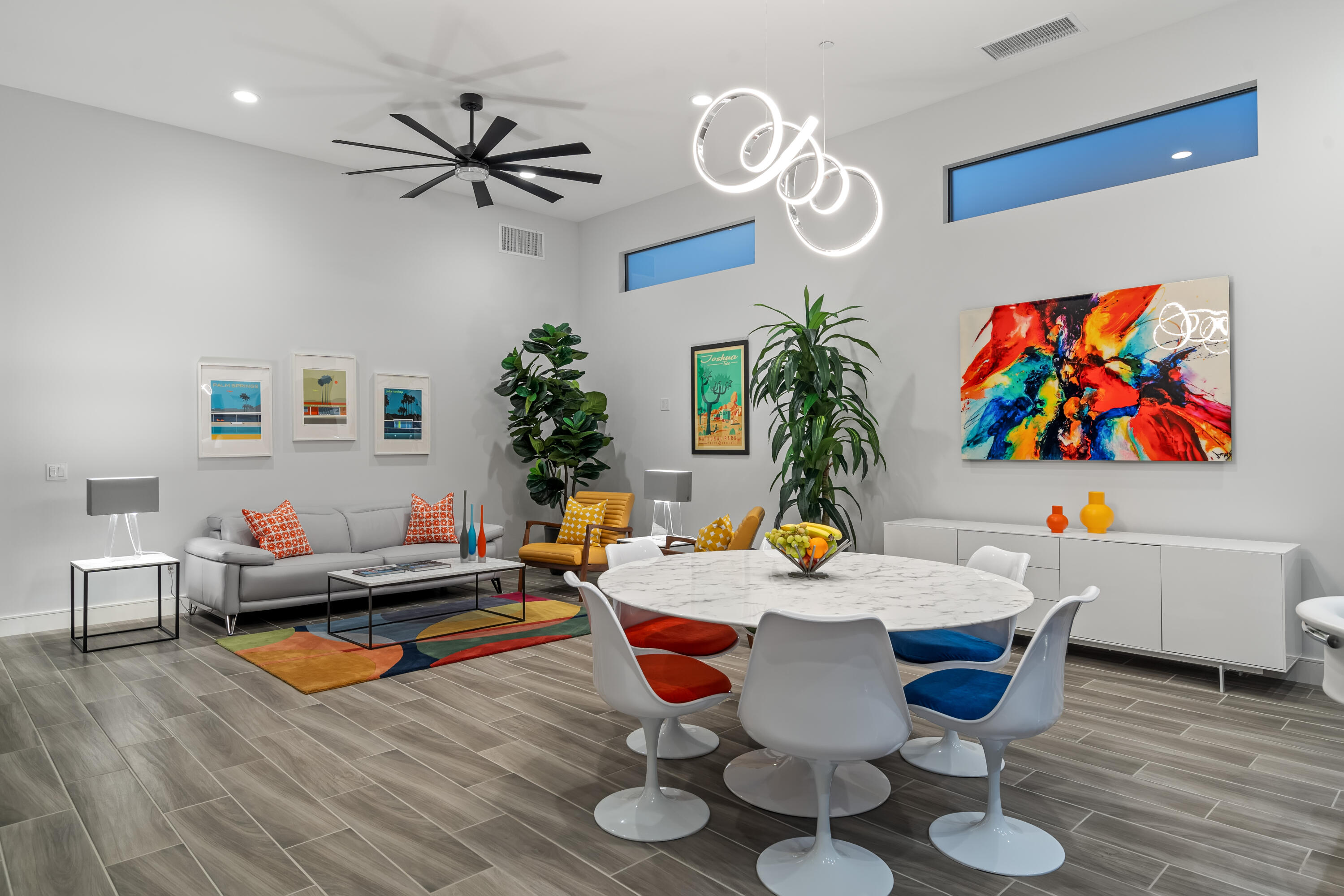 a dining room with furniture and wooden floor