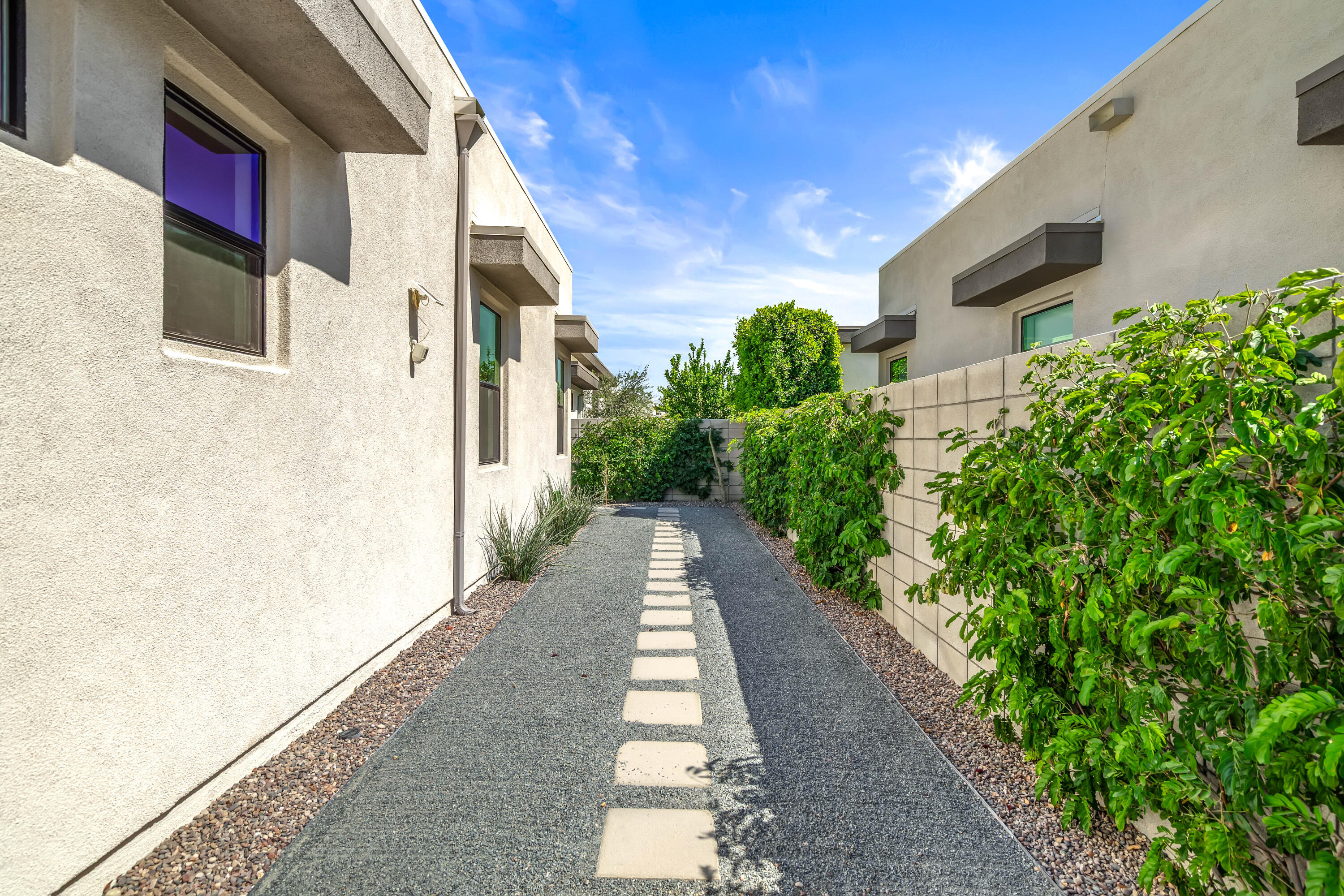 175 Vibe Way Palm Springs, CA 92262 - Photo 35 of 42 a view of a pathway with house on both side