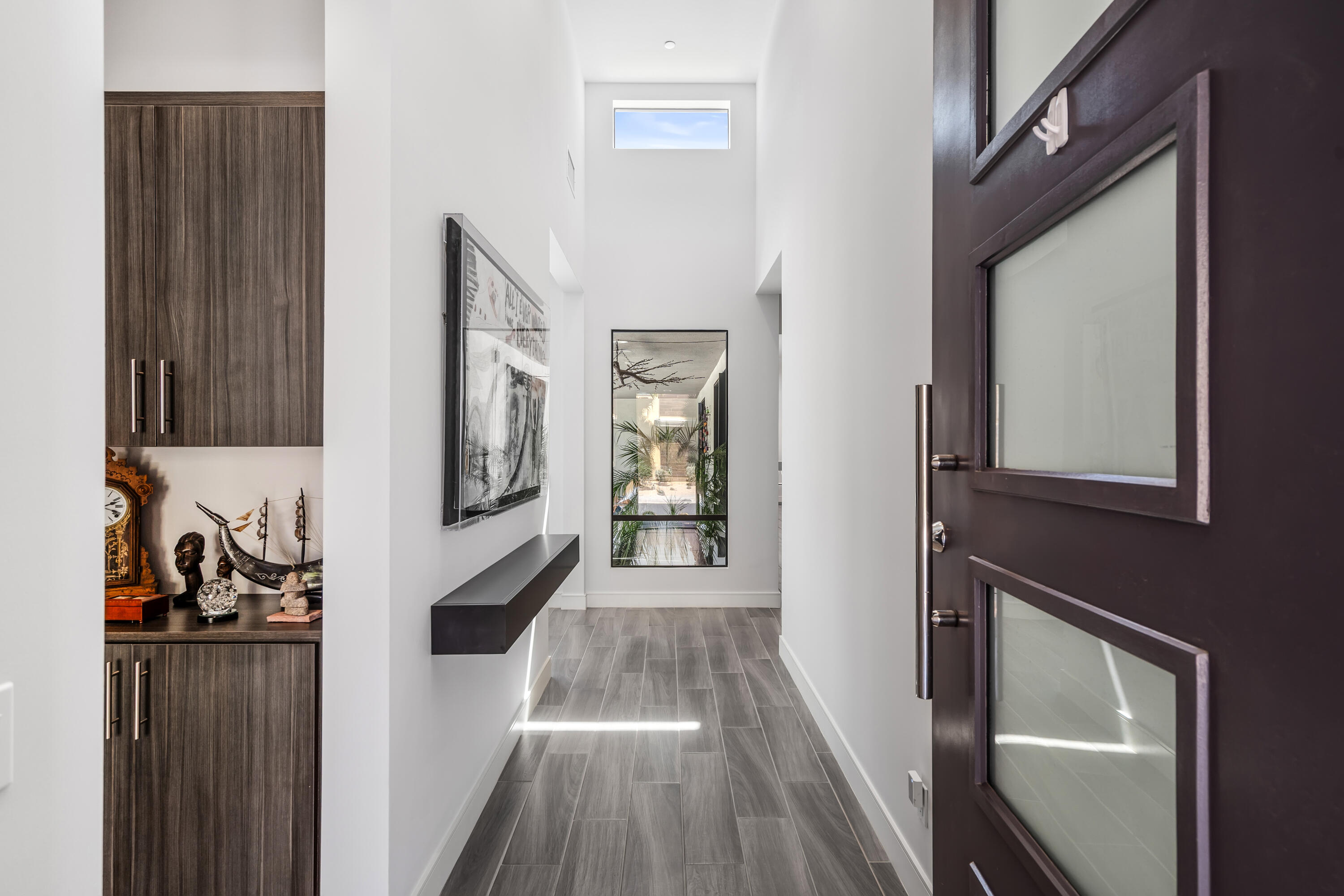 175 Vibe Way Palm Springs, CA 92262 - Photo 4 of 42 a view of a hallway with wooden floor and staircase