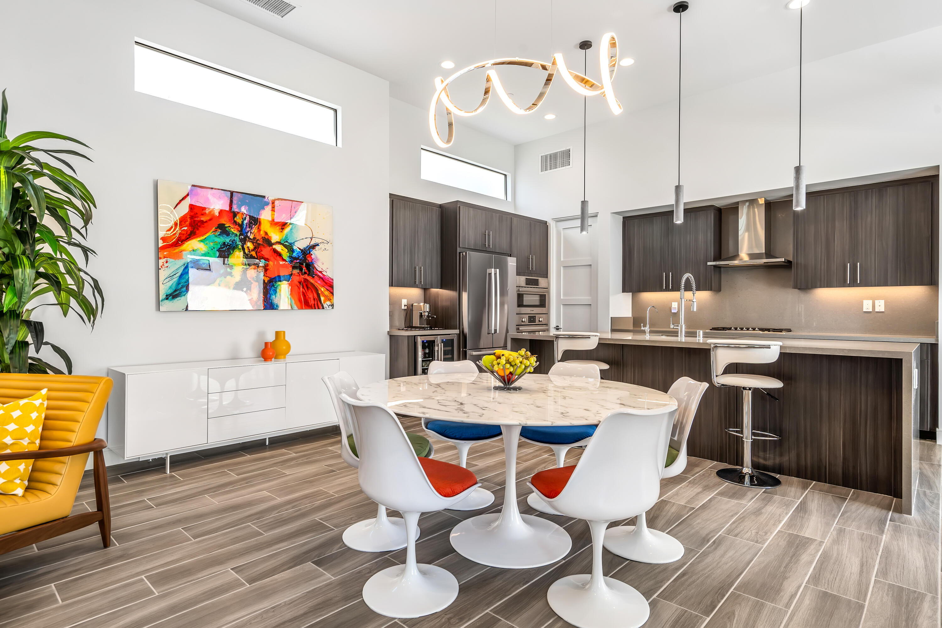 175 Vibe Way Palm Springs, CA 92262 - Photo 8 of 42 a view of kitchen with stainless steel appliances granite countertop a dining table chairs and a microwave