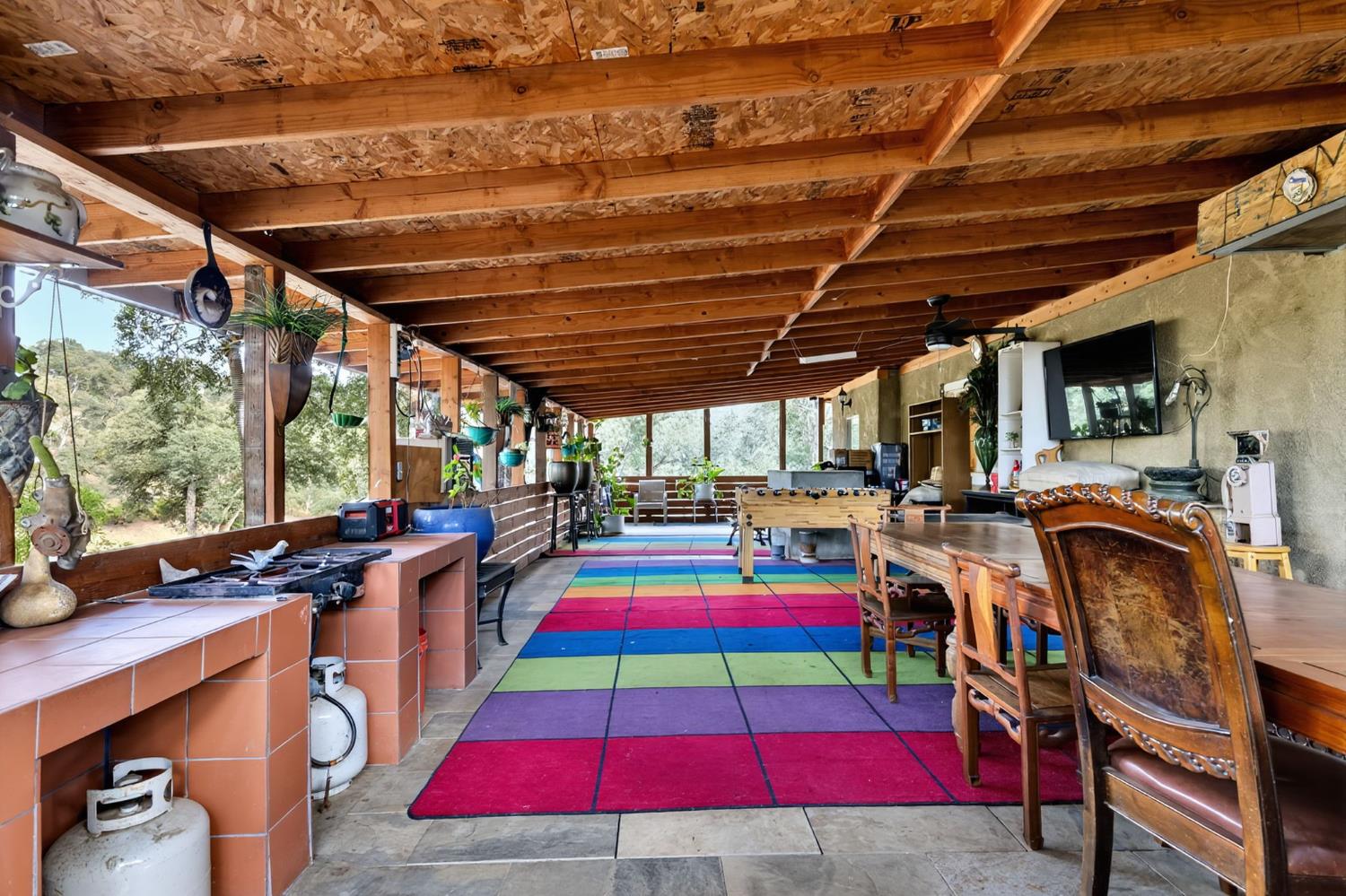 5263 Chile Camp Road Campo Seco X, CA 95226 - Photo 15 of 24 a room with musical instruments and wooden walls