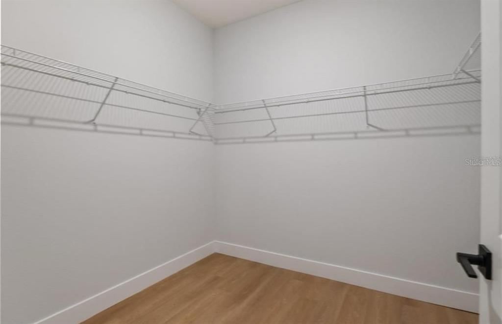 5550 Southwest 107th Street Ocala, FL 34476 - Photo 11 of 15 a view of a room with racks on the wall