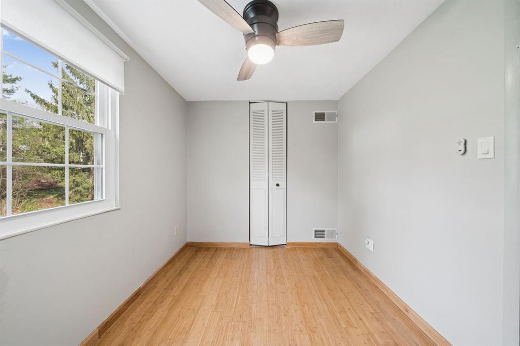 446 Diablo Drive Pittsburgh, PA 15241 - Photo 24 of 39 a view of empty room with wooden floor and fan