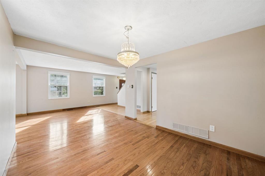 446 Diablo Drive Pittsburgh, PA 15241 - Photo 5 of 39 a view of an empty room with window and wooden floor