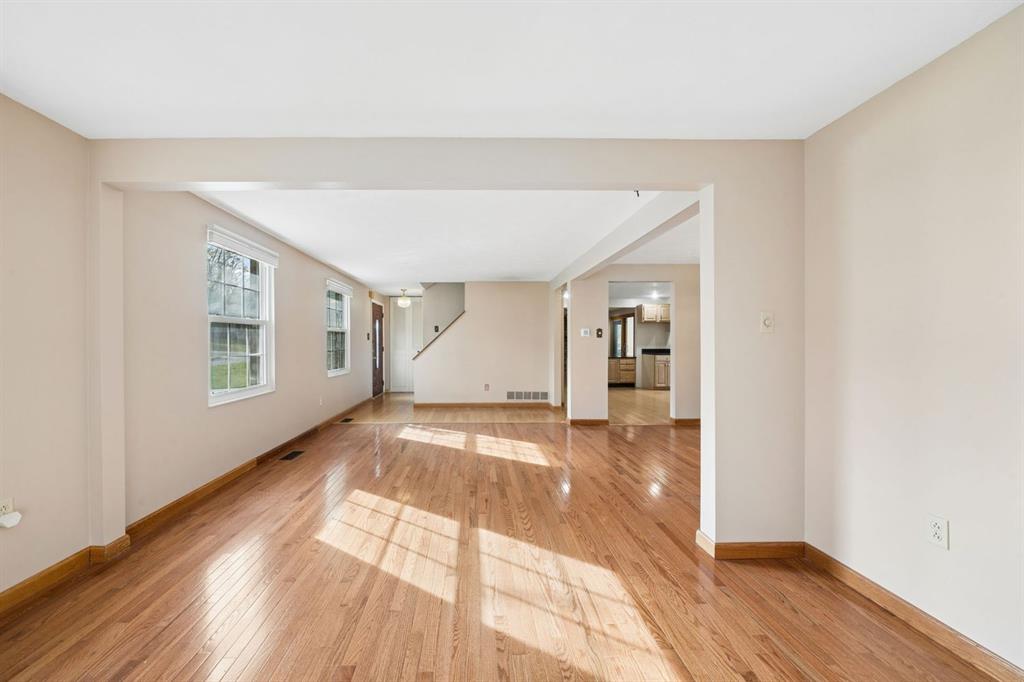 446 Diablo Drive Pittsburgh, PA 15241 - Photo 7 of 39 a view of an empty room with wooden floor and a window
