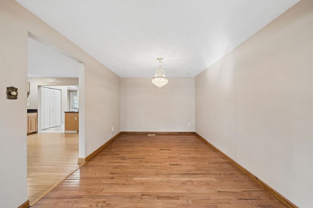 446 Diablo Drive Pittsburgh, PA 15241 - Photo 8 of 39 a view of an empty room with wooden floor and a window