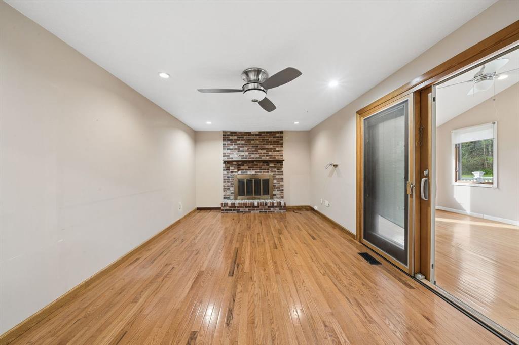 446 Diablo Drive Pittsburgh, PA 15241 - Photo 10 of 39 a view of a big room with wooden floor a ceiling fan and windows