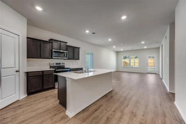 a backyard of a house with wooden fence