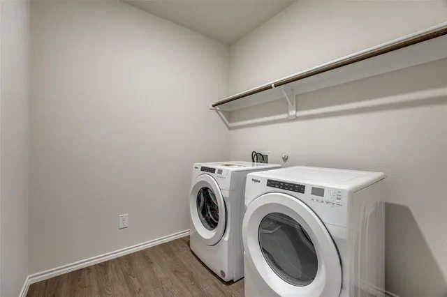 a bathroom with a sink a toilet and a large mirror
