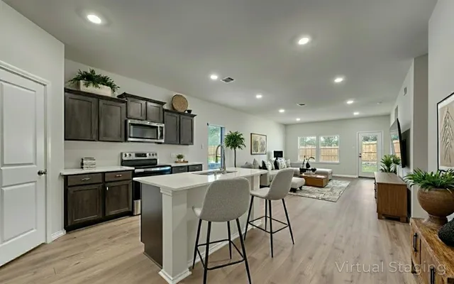 a view of kitchen with sink and wooden floor