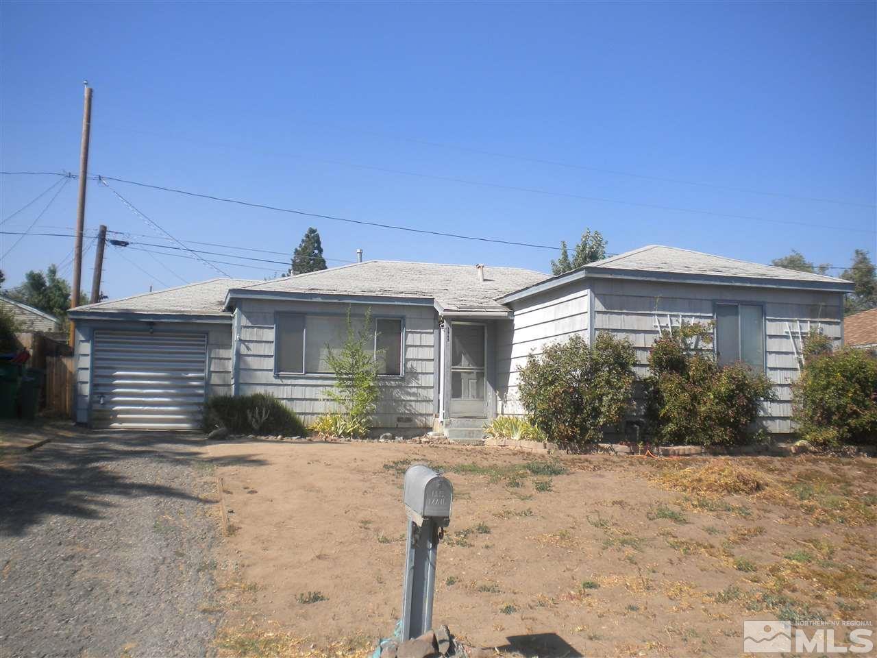 1945 Ellendale Road Reno, NV 89503 - Photo 1 of 1 a front view of a house with a yard