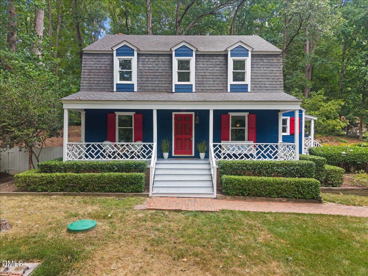6516 Bakersfield Drive Raleigh, NC 27606 - Photo 51 of 59 a front view of a house with a yard