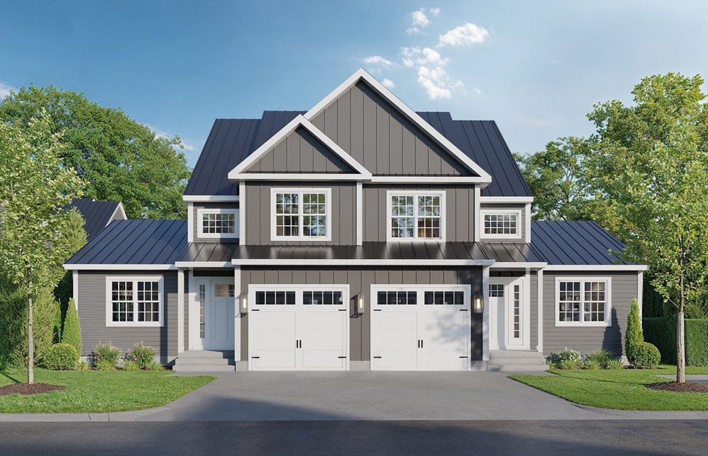 a view of a white house with a yard and potted plants