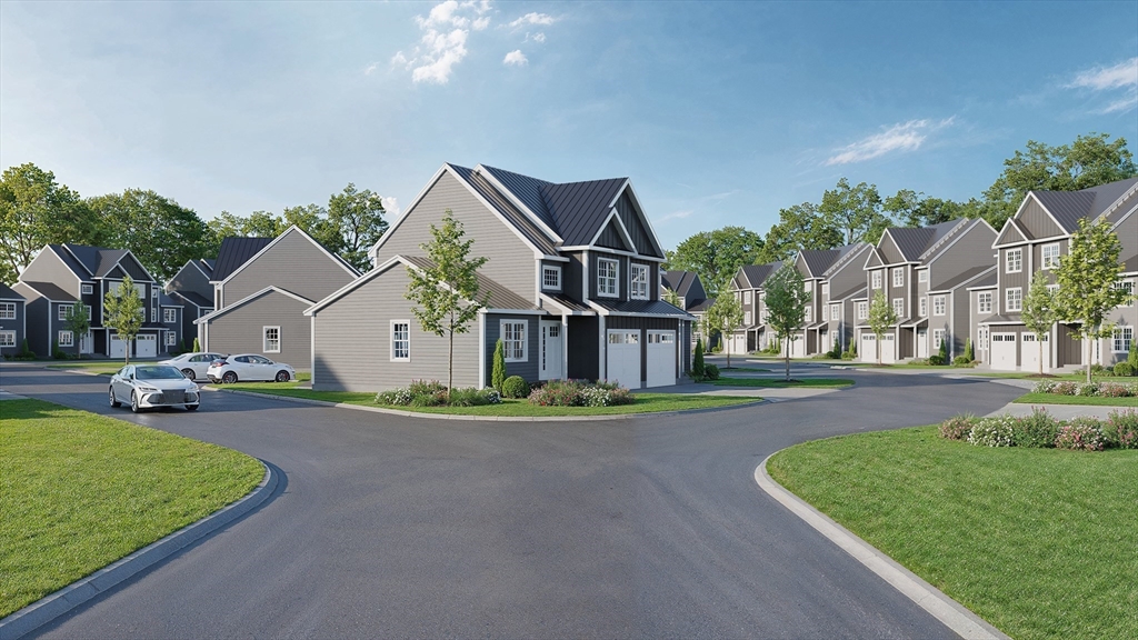 25 Vinal Street, Unit 29 Auburn, MA 01501 - Photo 4 of 7 a front view of a house with a garden and trees