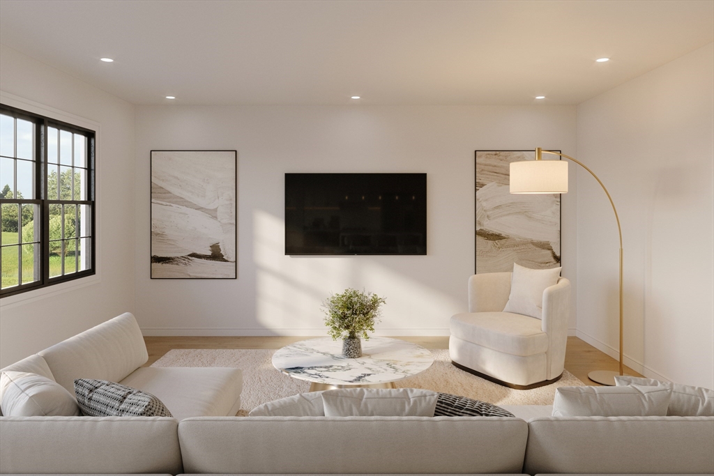 25 Vinal Street, Unit 29 Auburn, MA 01501 - Photo 7 of 7 a living room with furniture and a flat screen tv