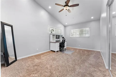 a view of a room with gym equipment and a window