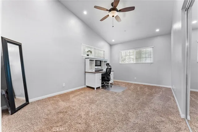 a view of a room with gym equipment and a window