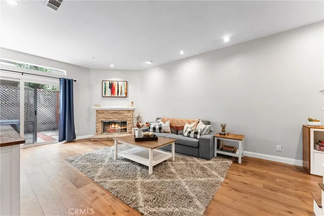 a living room with furniture and a rug