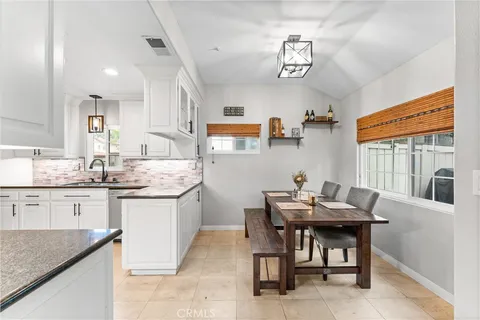 a kitchen with a sink and stove