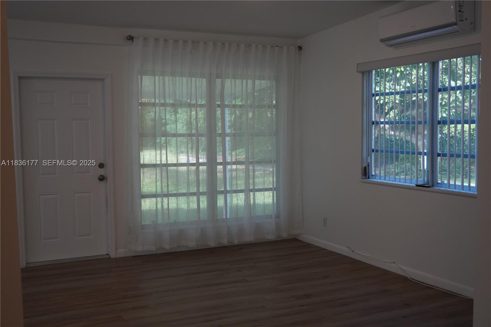 7800 Southwest 69th Avenue Miami, FL 33143 - Photo 12 of 24 a view of wooden floor and windows in a room