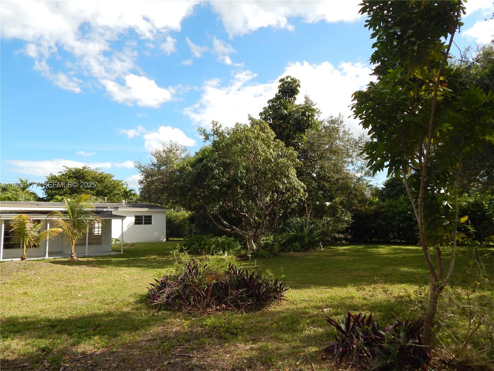 7800 Southwest 69th Avenue Miami, FL 33143 - Photo 20 of 24 a view of a house with a yard