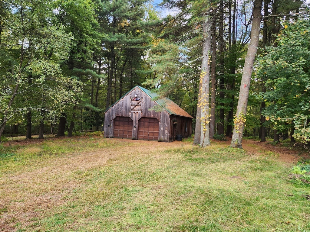 0 Chestnut Street East Longmeadow, MA 01028 - Photo 2 of 8 a large tree in front of a house with large trees