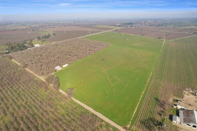 a view of a yard with an ocean view