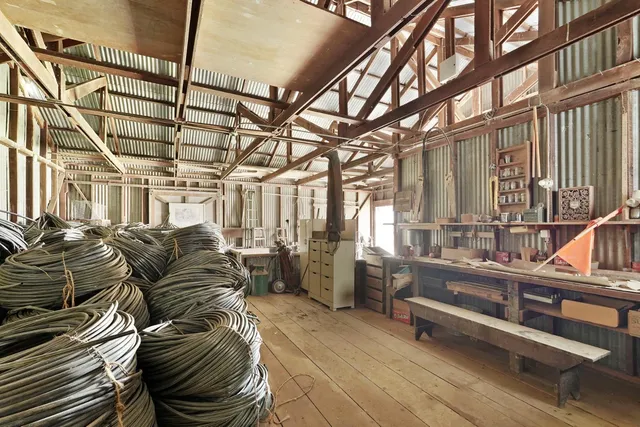 a view of dirt yard with a tree