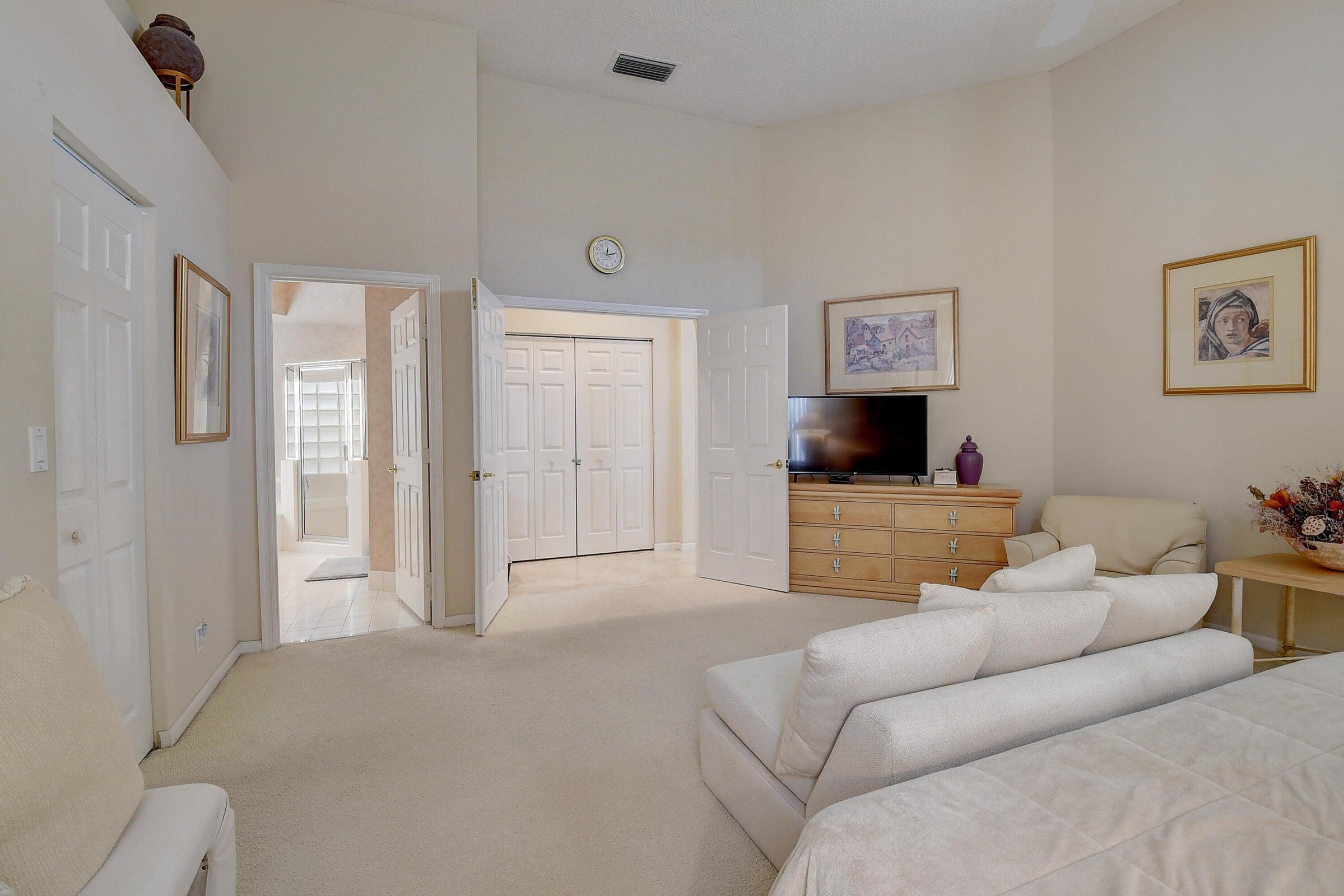 7725 Rockford Road Boynton Beach, FL 33472 - Photo 13 of 47 a living room with furniture and a flat screen tv