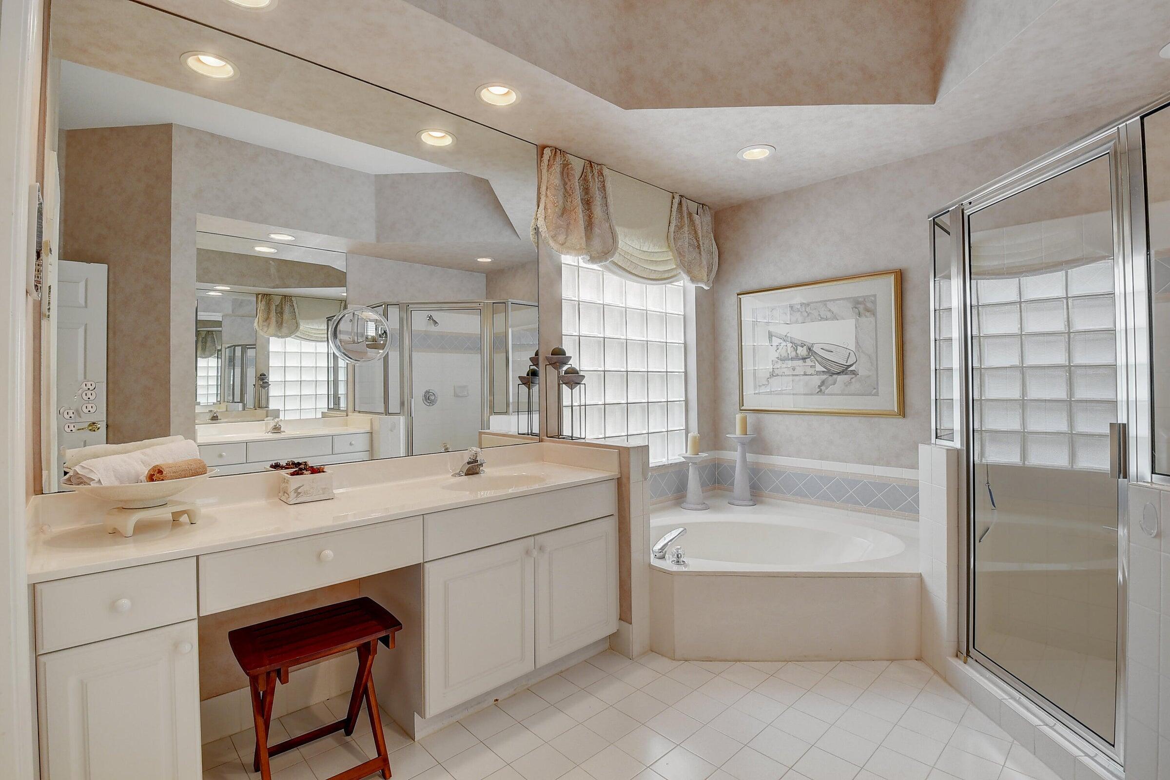 7725 Rockford Road Boynton Beach, FL 33472 - Photo 15 of 47 a bathroom with a tub sink and mirror