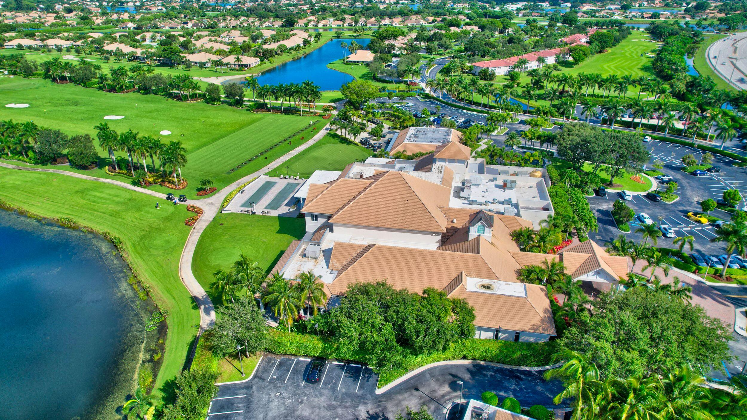 7725 Rockford Road Boynton Beach, FL 33472 - Photo 29 of 47 an aerial view of a house with a garden and lake view