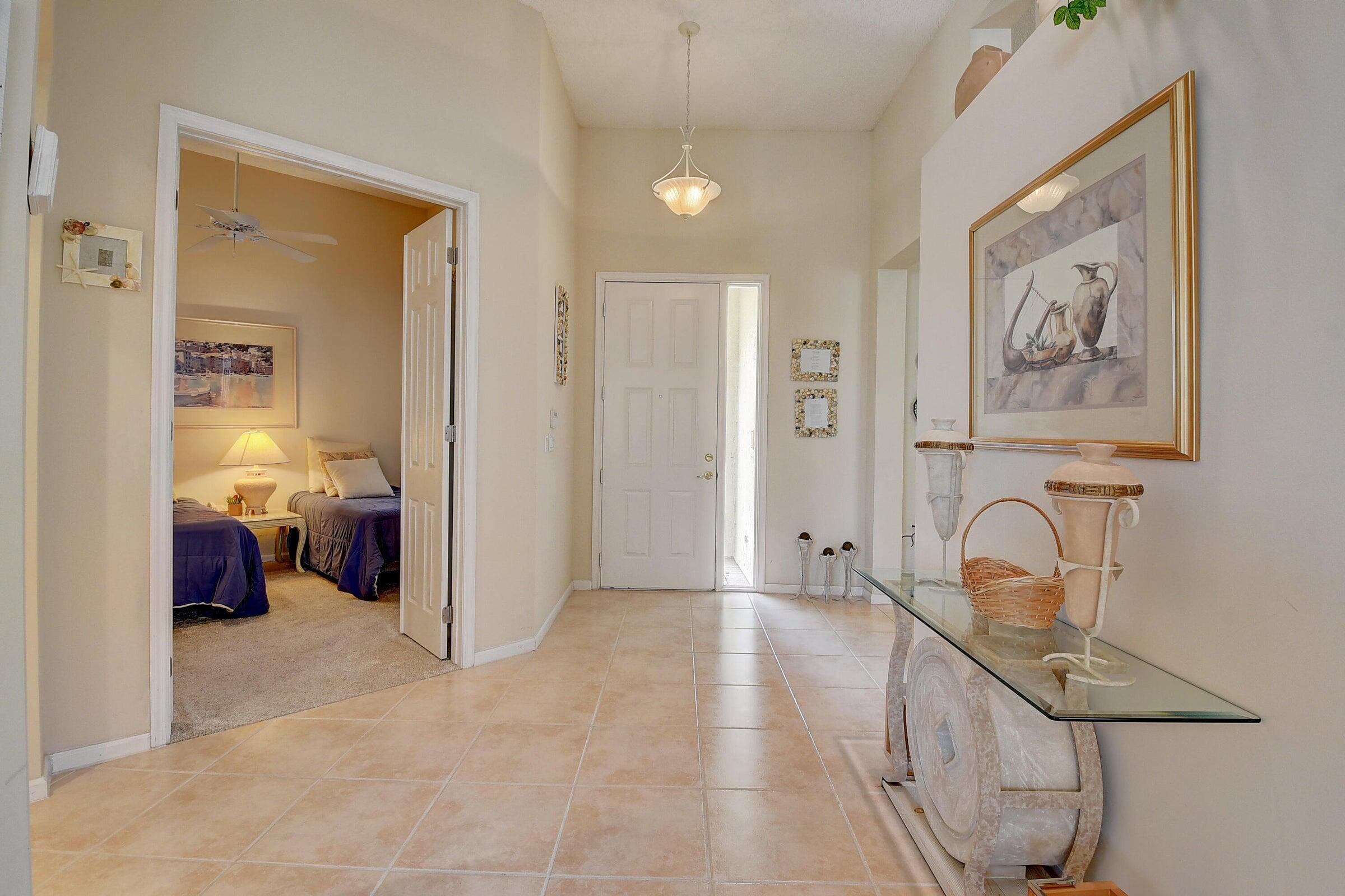 7725 Rockford Road Boynton Beach, FL 33472 - Photo 5 of 47 a view of a room with bed closet and mirror