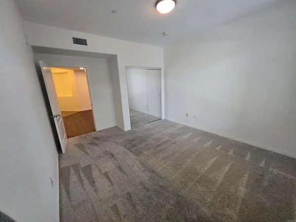 an empty room with a mirror