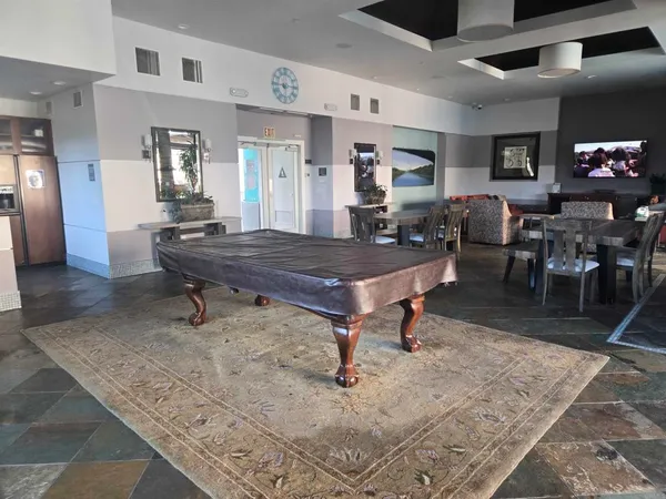 a kitchen with stainless steel appliances granite countertop a sink and a stove