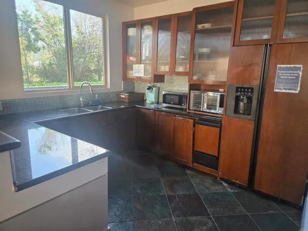 a dining room with furniture window and wooden floor