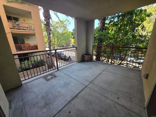 a view of a porch with wooden floor and outdoor space