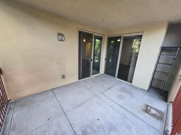 a view of hallway with window and stairs