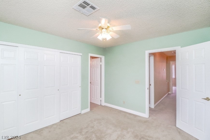 1429 Hawkwood Road Henderson, NV 89014 - Photo 30 of 53 Plush carpeted flooring and multiple closets define this bedroom space.