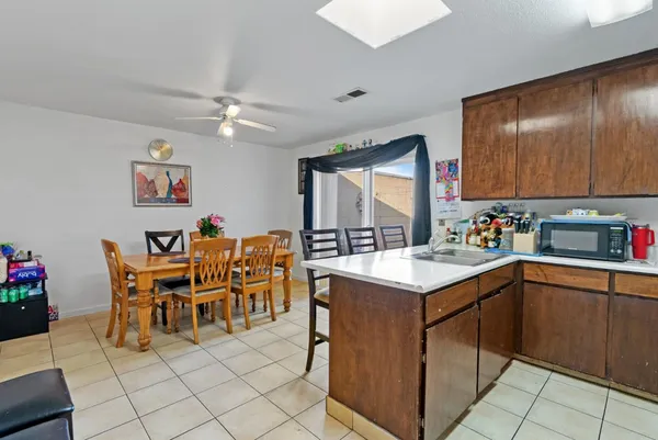a kitchen with a cabinets and chairs