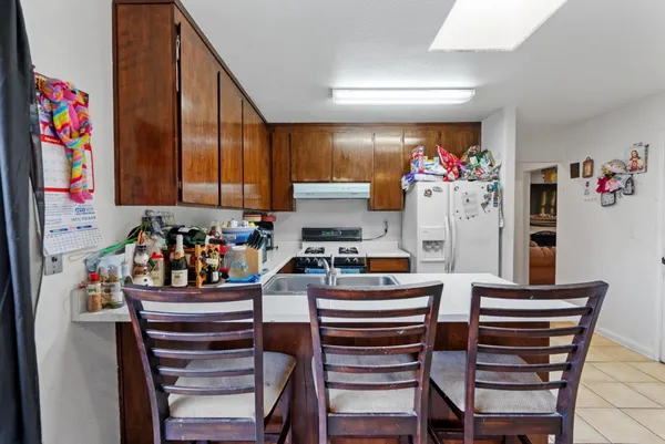 a room with furniture a garage and a flat screen tv