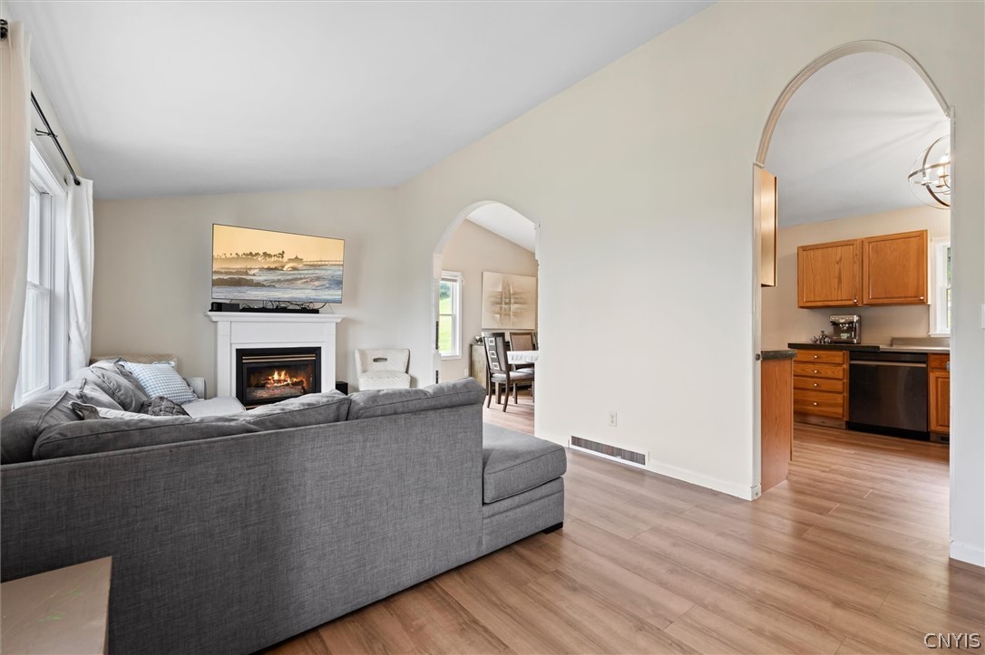 4615 Broad Road Onondaga, NY 13215 - Photo 10 of 47 Open flow between kitchen and main living spaces.