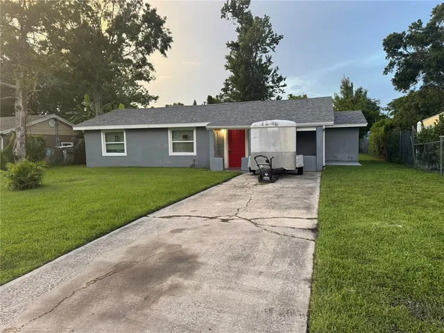 front view of a house with a yard
