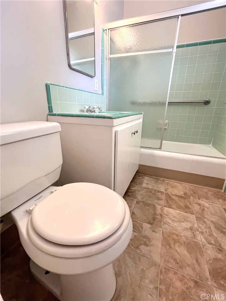 10 West Cypress Avenue Redlands, CA 92373 - Photo 11 of 11 a bathroom with a toilet a sink and a bathtub