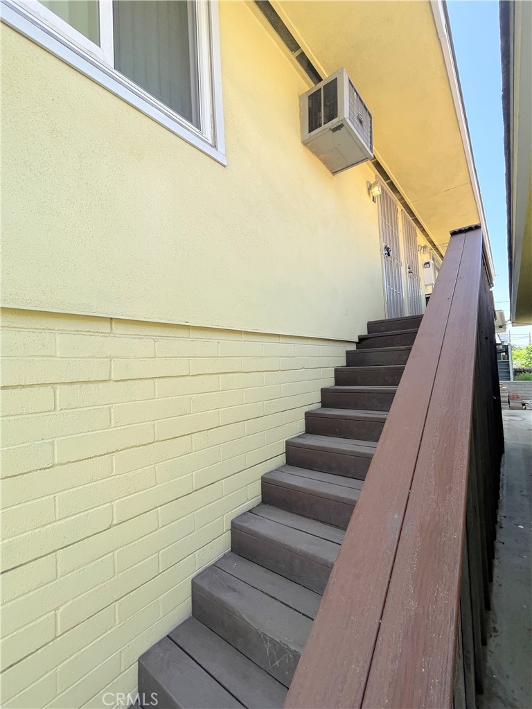 10 West Cypress Avenue Redlands, CA 92373 - Photo 2 of 11 a view of staircase with wooden floor and white walls