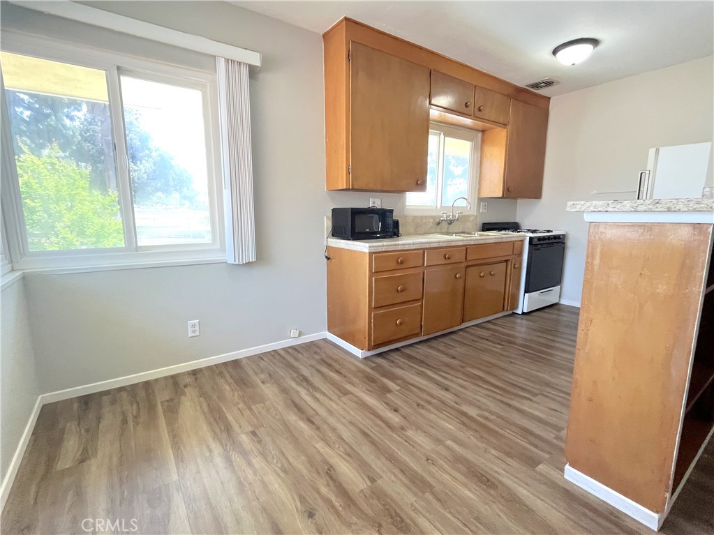 10 West Cypress Avenue Redlands, CA 92373 - Photo 5 of 11 a room with wooden floors and window