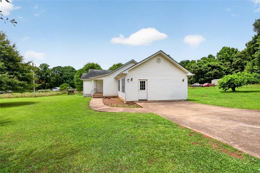 602 Pendergrass Road Winder, GA 30680 - Photo 6 of 44 a view of a house with a yard and sitting area