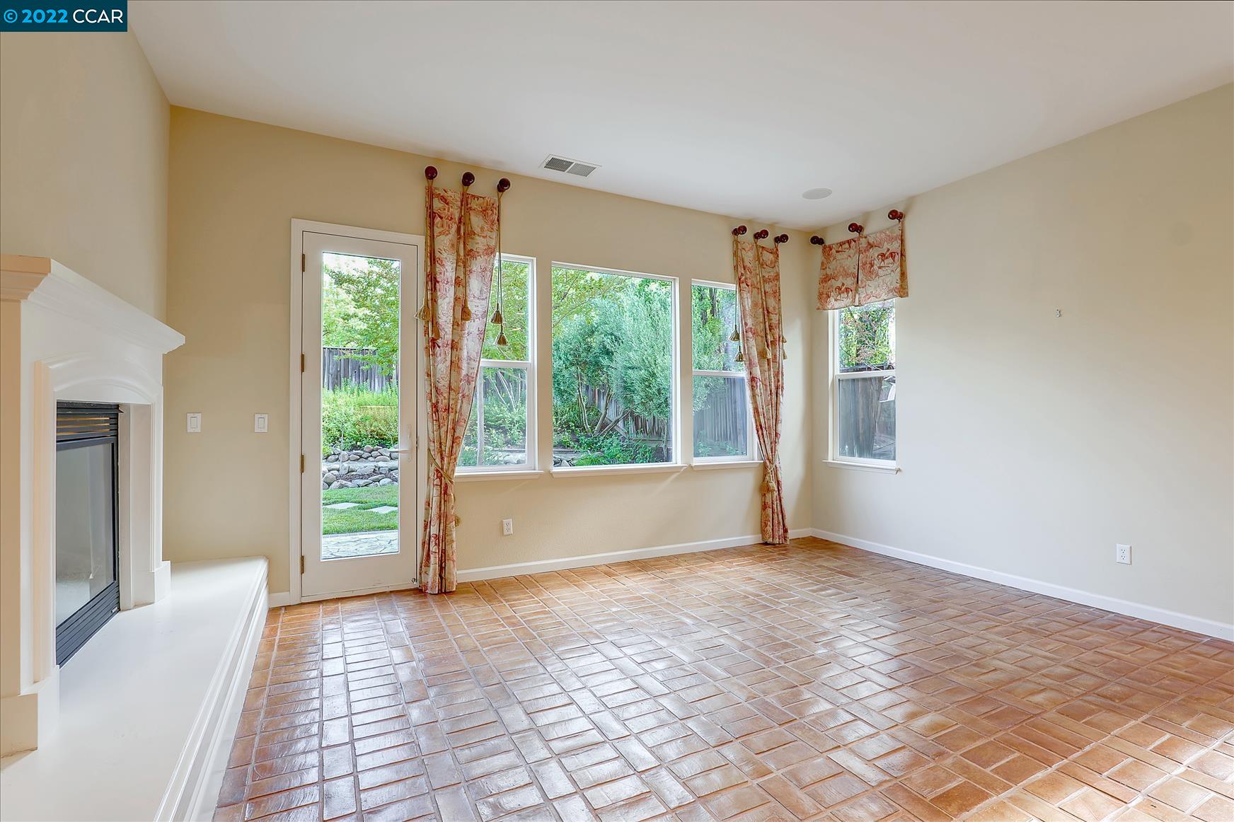 109 Elegans Court San Ramon, CA 94582 - Photo 17 of 41 a view of an empty room with wooden floor and a window
